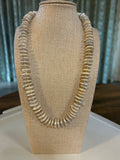 White pearl rondelle necklace on a mannequin bust. 