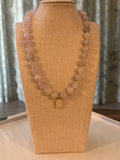 Necklace on a tan fabric display