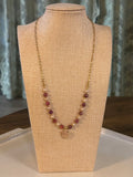 Necklace on a beige mannequin bust with a neutral background