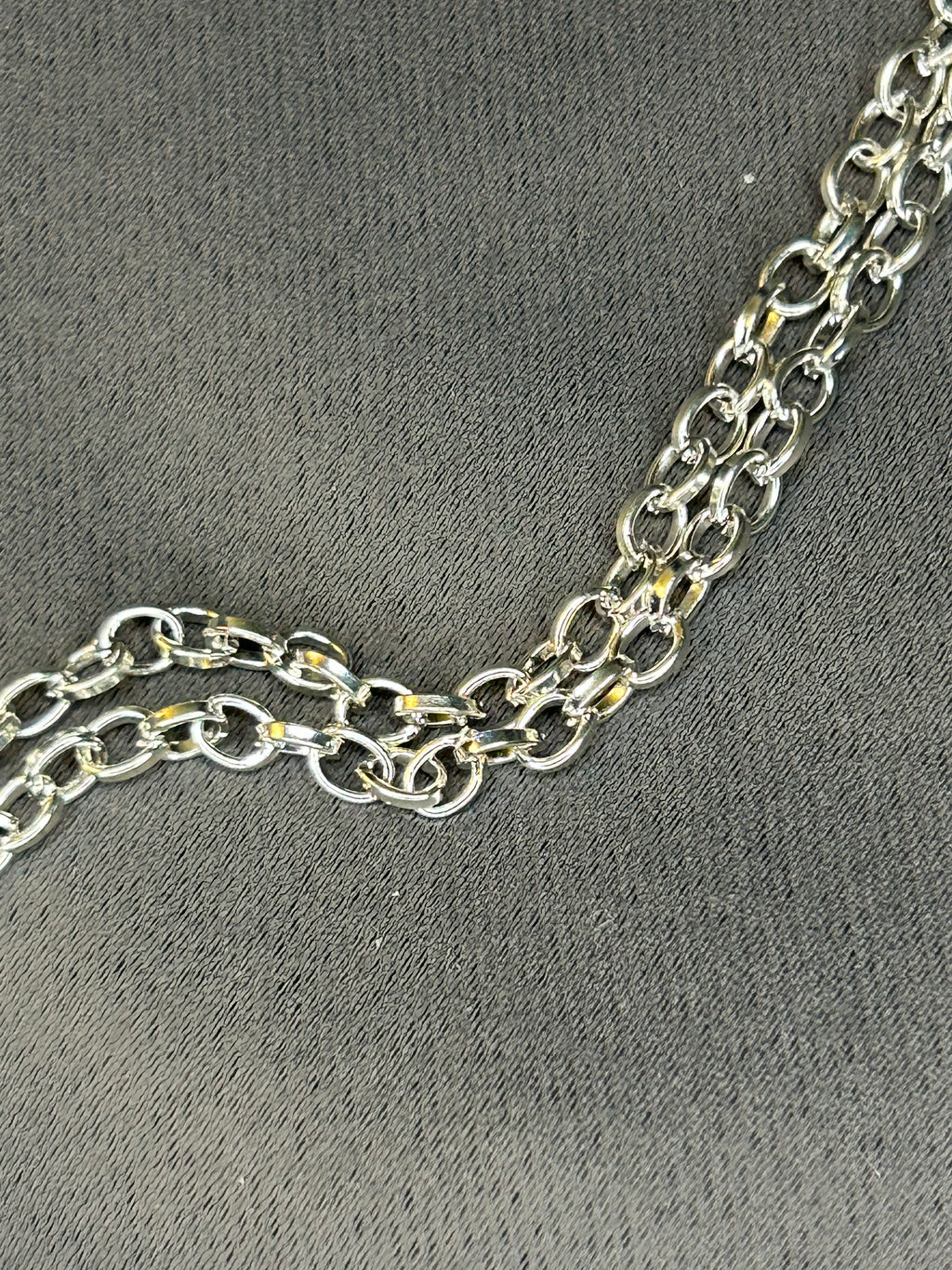 Silver chain on a gray textured background